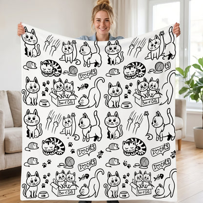 DIY coloring blanket, Box of Cats design, held up in a living room