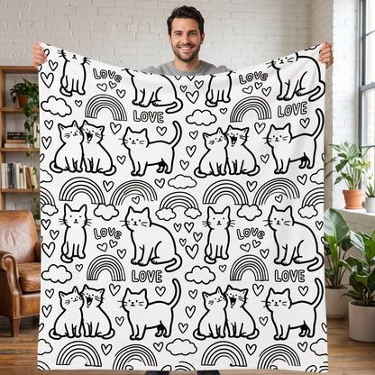 DIY coloring blanket, Cat & Rainbow design, held up in a living room
