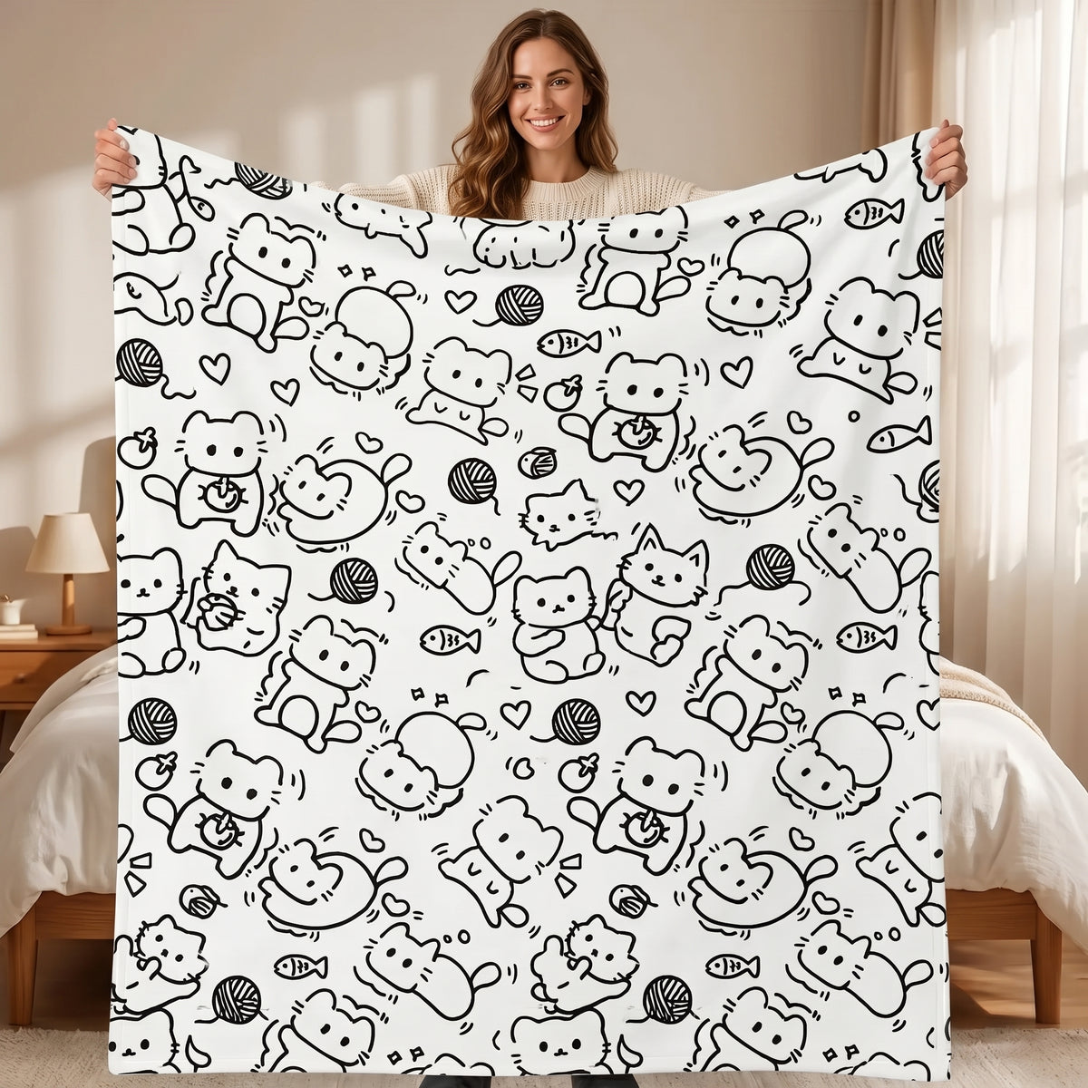 DIY coloring blanket, Cat Sketch design, held up in a living room