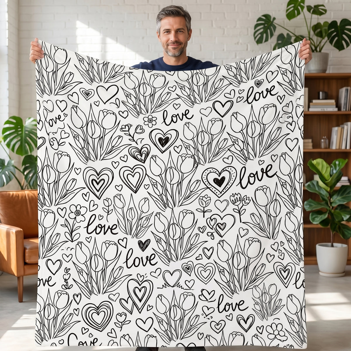 DIY coloring blanket, Tulip & Love design, held up in a living room
