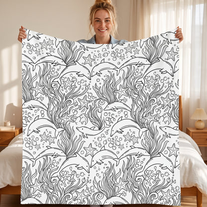 DIY coloring blanket, Dolphin design, held up in a living room
