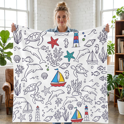 DIY coloring blanket, Marine Life design, held up in a living room