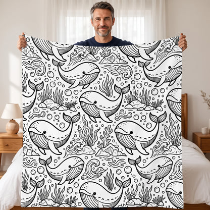 DIY coloring blanket, Whale design, held up in a living room