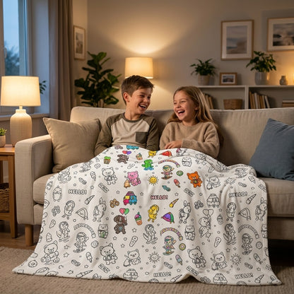 Two kids sitting together under a colored-in throw blanket on the sofa