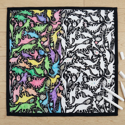 Dino Party coloring blanket half colored in, half plain, showing before and after