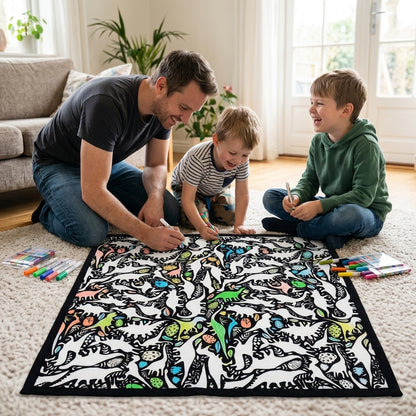 Father and two sons coloring the Dino Party coloring blanket together on the living room floor